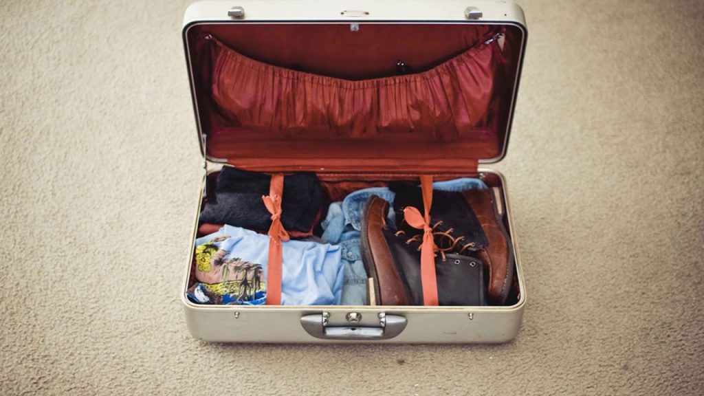 packing-clothes-for-travel-in-suitcase